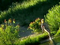 Our cameraman was sitting in the bushes on the opposite bank of the river voyeuring the nudist beach on the camera